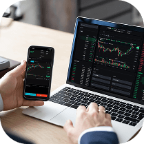 looking at a computer and phone