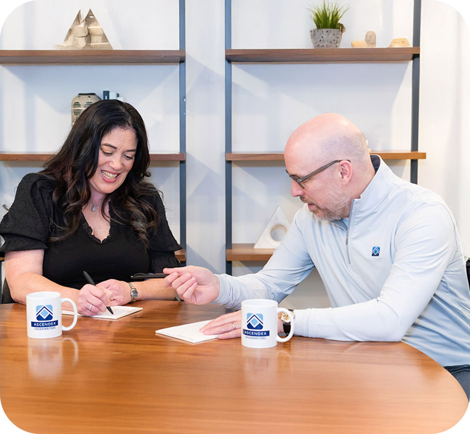 two people in ascendex's office